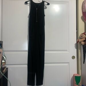 Worn once. Black jumpsuit. Stretch to waist band. Size Medium